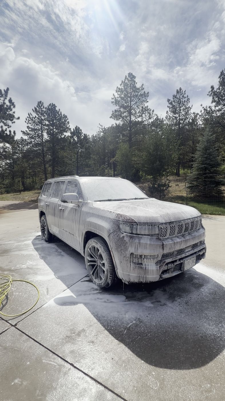 Sedan covered in foam during a mobile detail